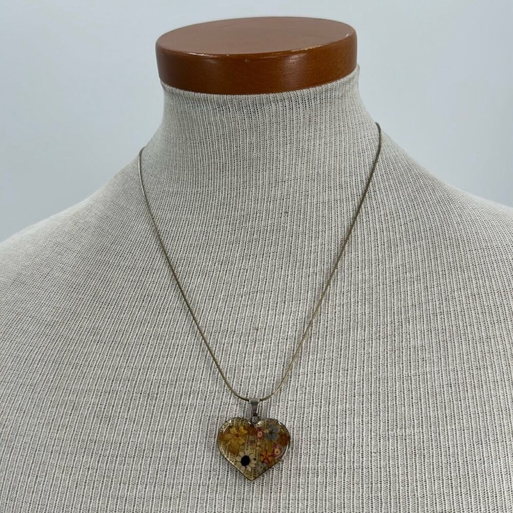 Sterling silver pressed flowered in a resin heart necklace